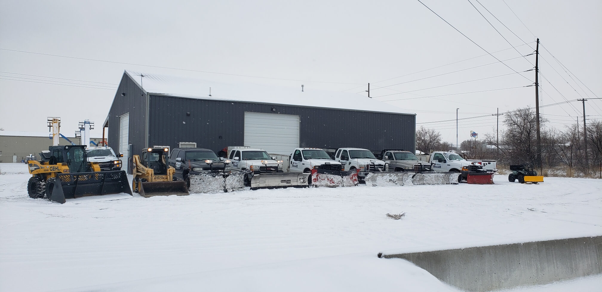 snow plow truck plowing a road